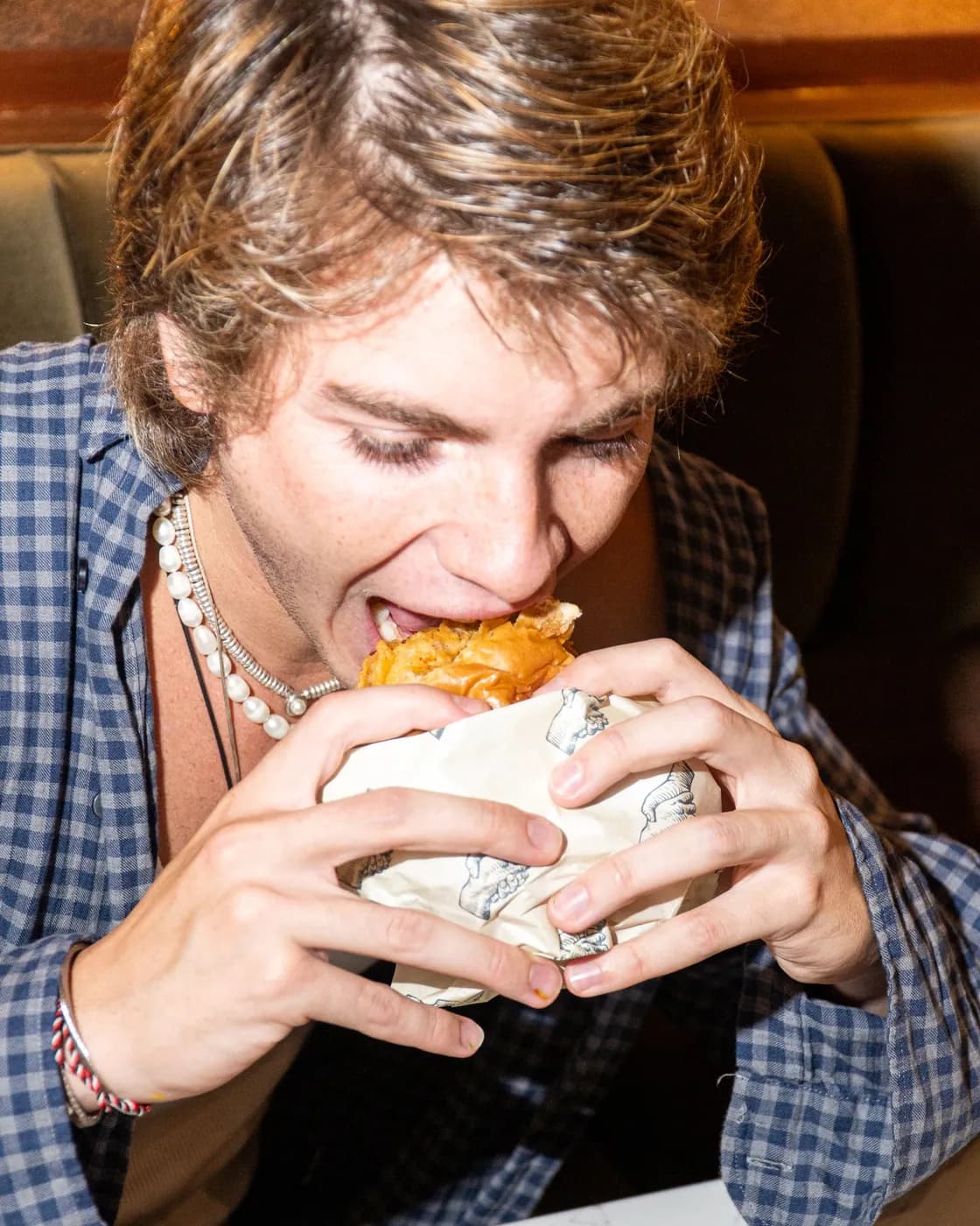 A bite of a wrapped Scratch burger