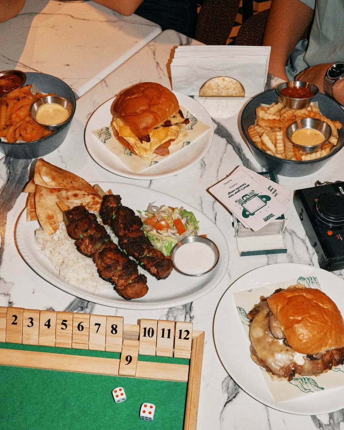 Group table with burgers and kebabs