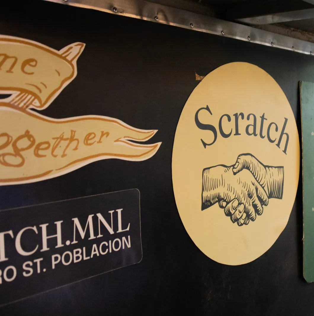 Scratch handshake roundel, come together ribbon, and @scratch.mnl plate on the burger truck