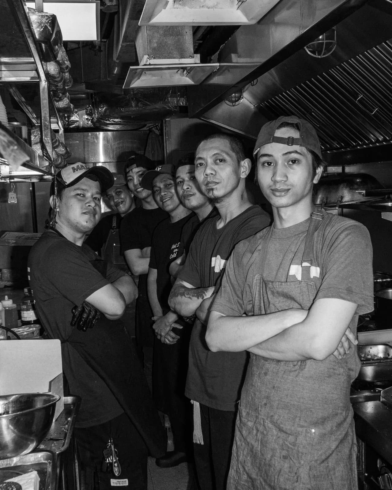 The Scratch crew in green aprons in front of the counter