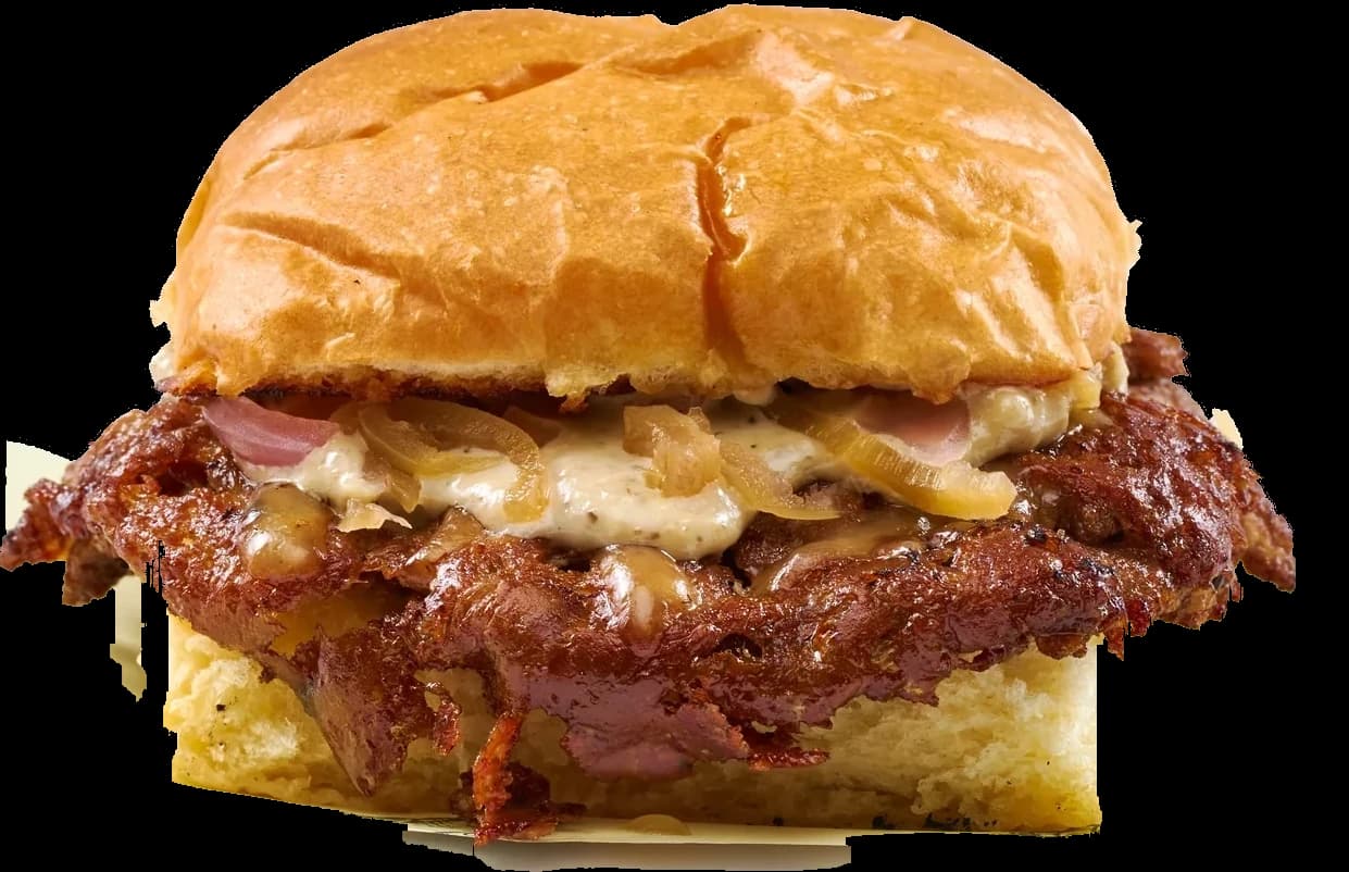 Umami Truffle Burger with gouda and chili onion relish on a potato bun