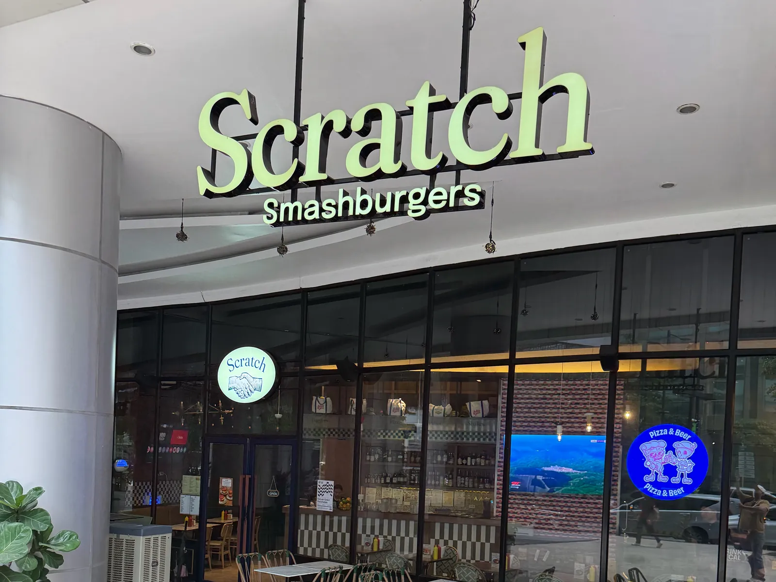 Scratch Eastwood storefront with the Scratch Smashburgers sign and outdoor tables